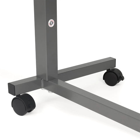 Close-up of Heavy Duty Adjustable Overbed Table With Ball Bearing Casters, showing sturdy chrome base and black locking wheels.
