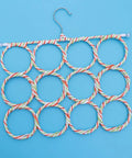 Foldable Paper Rattan Scarf Hanger Featuring 20 Rings And Sturdy Steel Hook Hangs From Door Or Closet Rod for ties and belts, shown flat.