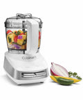 Core Custom 4 Cup Mini Chopper And Food Processor For Quick Chops And Grinds With Auto Reversing Stainless Steel SmartPower Blade And One Touch Paddle Controls And Dishwasher Safe Parts White And Stainless showing chopped vegetables in bowl