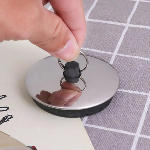 2pcs Rubber Bathtub Drain Stopper for Kitchen and Laundry Use, showcasing soft rubber and metal ring for easy removal.