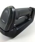 Wireless Bluetooth 2D And 1D Imager Barcode Scanner With 24 Inch Scan Range and cradle, twilight black, side view.