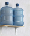 Gotta Have These Solid Flex L Shaped Shelf Brackets With Screws For Wall Mount Floating Shelves Heavy Duty Iron Corner Support displaying two water bottles on a wooden shelf.