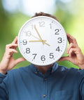 Person holding large clock with gold hands, using Metal Clock Hands Replacement Kit 10 Sets Handy DIY Wall Clock Hands For Home And Kitchen Repair.