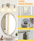Three Light Bathroom Vanity Light Fixture In Brushed Nickel With Clear Glass Shades Over Mirror Wall Sconce No Fuss Easy To Install