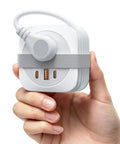 Road Trip Ready Compact Portable Power Strip Featuring Ridiculously Sleek Wrap Around Build And Plug Play 20W Pd Fast Charging Usb Ports held in hand.