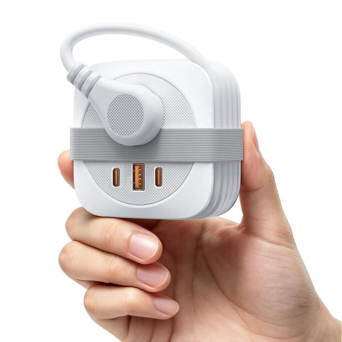 Road Trip Ready Compact Portable Power Strip Featuring Ridiculously Sleek Wrap Around Build And Plug Play 20W Pd Fast Charging Usb Ports held in hand.