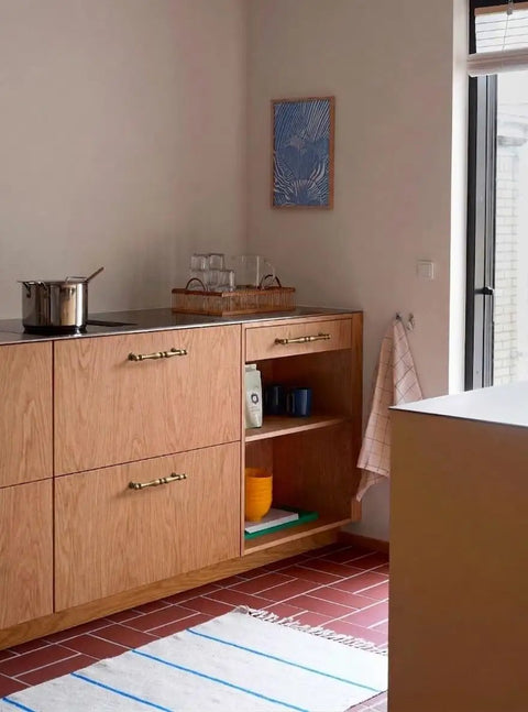 Kitchen cabinet with Six Pack Antique Brass Cabinet Pulls With 7.6 Inch Hole Center installed, showing vintage look.