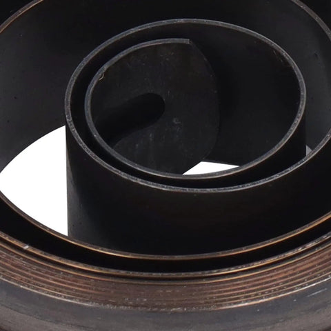 Close-up of Heavy Duty Drill Press Return Spring Coil Replacement for Quill made of durable spring steel for bench drills.
