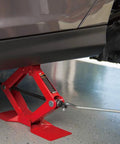 Heavy Duty Steel Scissor Lift Jack 1.5 Ton Car Kit lifting a vehicle from 4 1/8 to 15 1/8 inches, compact and rugged.