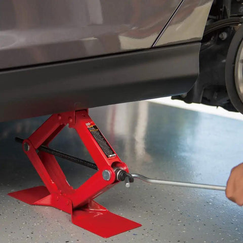 Heavy Duty Steel Scissor Lift Jack 1.5 Ton Car Kit lifting a vehicle from 4 1/8 to 15 1/8 inches, compact and rugged.