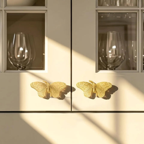 Heavy Duty Butterfly Cabinet Knobs With Slick Brushed Gold Finish For Dressers Crafted From Legit Solid Brass Featuring Smooth Wings on cabinets