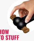 Extreme Goodie Bone Built Tough For Power Chewers Durable Natural Rubber Black For Large Dogs Great For Chew Sessions And Mental Stimulation That Lasts Longer Than Ordinary Toys. Black rubber dog bone with treats stuffed in ends