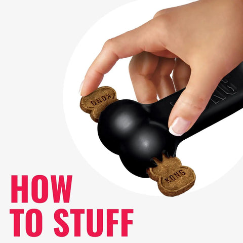 Extreme Goodie Bone Built Tough For Power Chewers Durable Natural Rubber Black For Large Dogs Great For Chew Sessions And Mental Stimulation That Lasts Longer Than Ordinary Toys. Black rubber dog bone with treats stuffed in ends