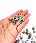Rock Solid 100 Piece Mini Metal Hinges 10 X 8mm 180 Degree Smooth Swinging Hardware For Jewelry Chests Dollhouse Cabinets And Diy Woodworking With Screws Included in hand.