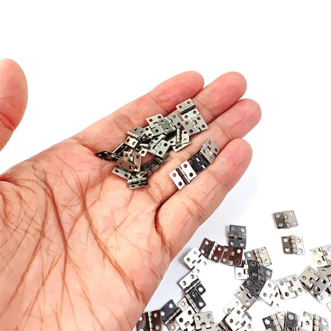 Rock Solid 100 Piece Mini Metal Hinges 10 X 8mm 180 Degree Smooth Swinging Hardware For Jewelry Chests Dollhouse Cabinets And Diy Woodworking With Screws Included in hand.