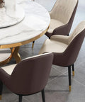 Kickback Ready Round Marble Dining Table Built For Epic Weekend Hangouts Featuring A Smooth White Spinning Lazy Susan And Bold Gold Stainless Steel Base Stretching Fifty Nine Inches Wide with elegant chairs.
