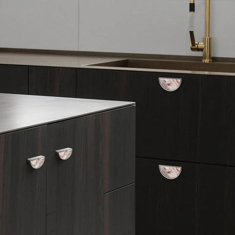Rose Gold Blush Fluid Cabinet Pulls 2 Pack 3 Inch Center Hole Semi Circle Drawer Handles with marble pattern installed on dark cabinets