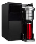 K-3500 Single Serve Commercial Coffee Maker For Busy Offices, 150 Plus Pod Varieties, side view with travel mug.