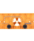 Get Ready For Serious Woodworking With This Ultimate Hinge Hole Saw Jig Set, showing the orange jig with hexagonal pattern and accessories.