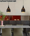 Industrial Wrought Iron Pendant Light Adjustable Single Head E27 Chandelier for Kitchen Island over a modern dining table.