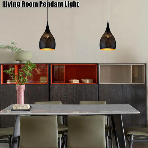 Industrial Wrought Iron Pendant Light Adjustable Single Head E27 Chandelier for Kitchen Island over a modern dining table.