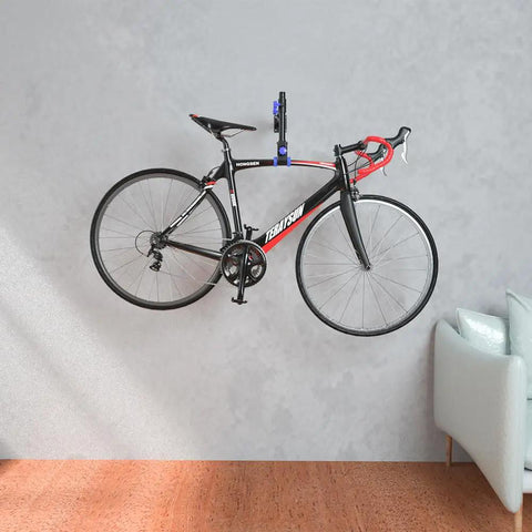 Wall Mount Bike Repair Stand With Telescoping Height From 18.9 to 27.2 Inches, 360 Degree Rotating Clamp For 16 to 29 Inch Bikes, Ultra Stable Mount Rack, DIY Friendly, Supports Up To 66 Lbs, Black holding a bicycle in living room.