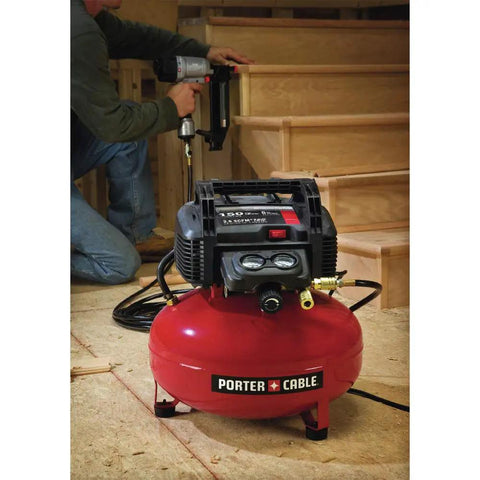 Workhorse Pancake Air Compressor With Six Gallon Oil Free Tank 150 PSI Max Pressure in garage with nail gun usage.