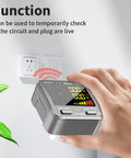 Hand using Outlet Tester With GFCI And NCV Non Contact Voltage Detection for North American outlets near a wall socket