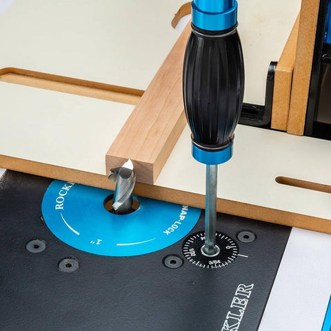 Close-up of Box Joint Router Jig With Precision Indexing For Router Table featuring steel sled and MDF base in use.