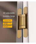 Matte gold Hidden Door Hinge Kit IGZVMBO Invisible Secret Hinge for Concealed Doors, cross-style, 120-180 kg, installed view.