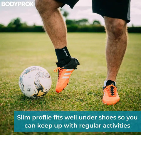 Person playing soccer with Lace Up Ankle Brace Unisex Support For Sprained Ankles, Durable Ankle Stabilizer For Men And Women, Medium Size