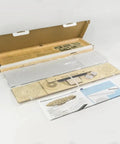 Contents of 1:408 Hindenburg Zeppelin 3D Wooden Model Kit With Display Case, showing laser-cut balsa wood and instructions.