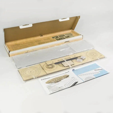 Contents of 1:408 Hindenburg Zeppelin 3D Wooden Model Kit With Display Case, showing laser-cut balsa wood and instructions.