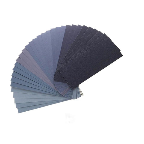 Grab Your Ultimate 60 Piece Sandpaper Pack For Wood Metal And Car Detailing! Assorted 9x3.6 inch sandpaper sheets fanned out.