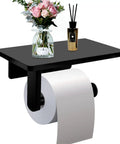 Toilet Paper Holder With Natural Marble Shelf For Bathroom Wall Mounted Tissue Holder For Mega Roll Chrome Finish Durable SUS304 Steel Build No Fuss Easy Install And Modern Washroom Accessory with flowers and diffuser.