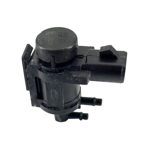 Side view of black plastic automotive hub-lock vacuum solenoid actuator with round top and side connector