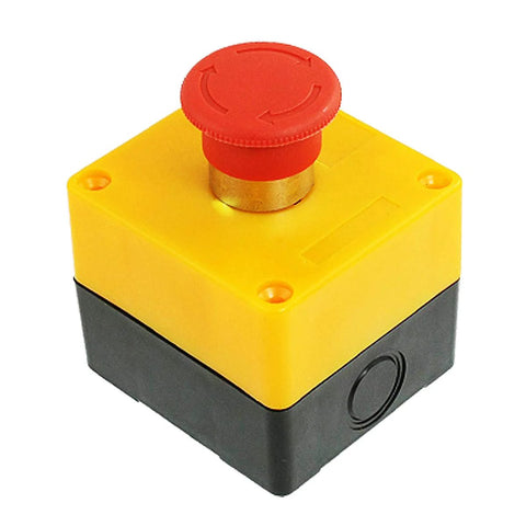 Angled front view of red mushroom emergency stop push button on yellow enclosure with black base.
