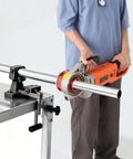Portable 2300W Electric Pipe Threader With Copper Motor For Cutting And Threading Metal Plastic Pipes Includes Six Dies Ranging From One Half To Two Inches Plus Carrying Case Makes Job Super Easy Professional Grade Tool in use on a metal pipe.