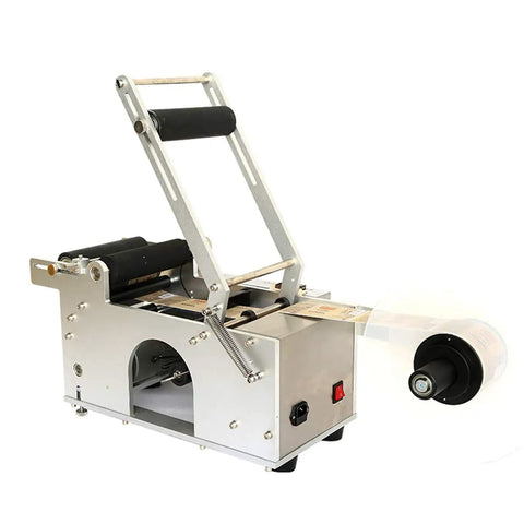 Heavy Duty Semi Auto Round Bottle Labeler For 15 To 120 Mm Containers Runs Like Clockwork At Forty Labels Per Minute, side view of machine.