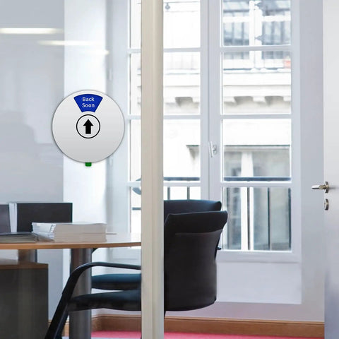 Rotating Privacy Door Sign For Office With Do Not Disturb Out Of Office Please Knock In A Meeting Working Remotely Back Soon Six Modes Easily Switched 6 Inch Silver, displaying 'Back Soon' mode on glass office door.