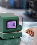Heavy Duty Digital Time Recorder Featuring Solid Steel Construction And Bright Backlit Lcd Display Designed For The Daily Grind And Rugged Work Floors Where Dependable Employee Tracking Never Misses A Beat On Busy Shopsites showing user clocking in.