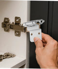 Installing self-closing recessed cabinet hinges on a door