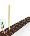 Guitar Fret Wire Setter for Luthier Professional Repair Tool next to a guitar fretboard, showing golden finish detail.