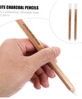 Hand holding a white charcoal pencil from the 4 Pack White Charcoal And Graphite Pencils Set For Art Drawing Dope Sketching Shading Blending Journaling Illustrations Pro Grade Quality For Realistic Artwork.