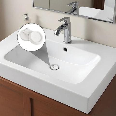 Heavy Duty Rubber Sink Stopper And Bathtub Drain Plugs Built Tough With A Slick Hang Loop in a white sink with faucet.
