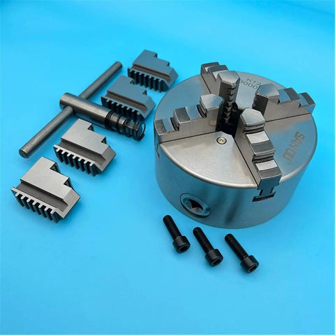 Rock Solid 130Mm Four Jaw Self Centering Lathe Chuck K12-130 with jaws and tools for precision machining on mini metal lathes.