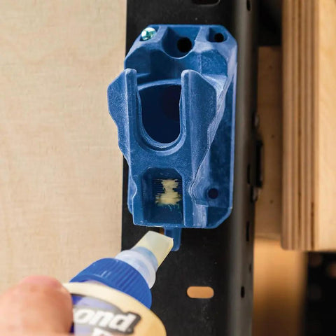 Upside Down Glue Bottle Dock Station With One Handed Access for 4oz, 8oz, 16oz bottles on wall with glue bottle using built-in opener