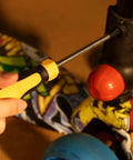 Using screwdriver from Must-Have All-In-One 198 Piece Home Repair Tool Kit With Plastic Toolbox For DIY Projects on scooter
