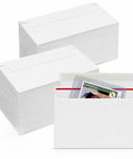 Stacks of Bulk Trading Card Shipping Envelopes 7 x 4.35 Inch Self Adhesive Mailers with a card inside, showing lightweight protectors.