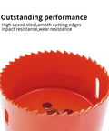 Red hole saw bit with serrated cutting edge, close-up view of cylindrical metal drill attachment